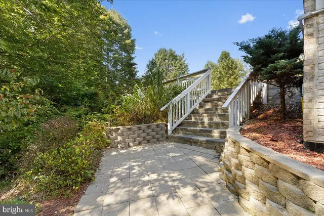 a view of staircase with white walls