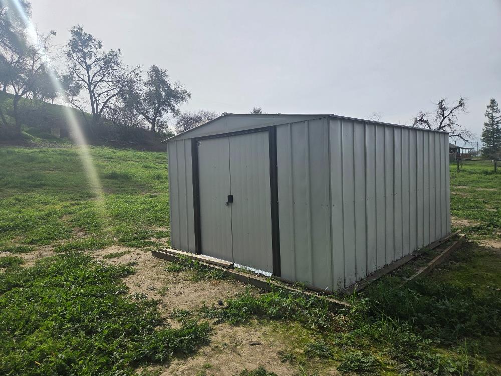 7824 Bollea Road Clements, CA 95227 - Photo 7 of 7 a view of a backyard with wooden fence