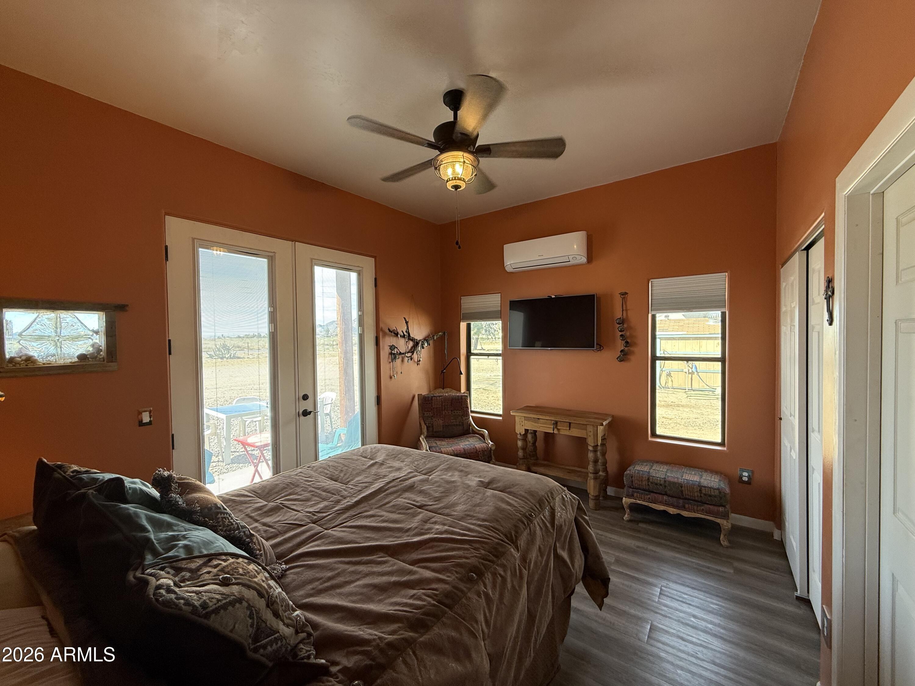 10545 North Ralston Road Maricopa, AZ 85139 - Photo 15 of 27 a bedroom with a bed and a chandelier