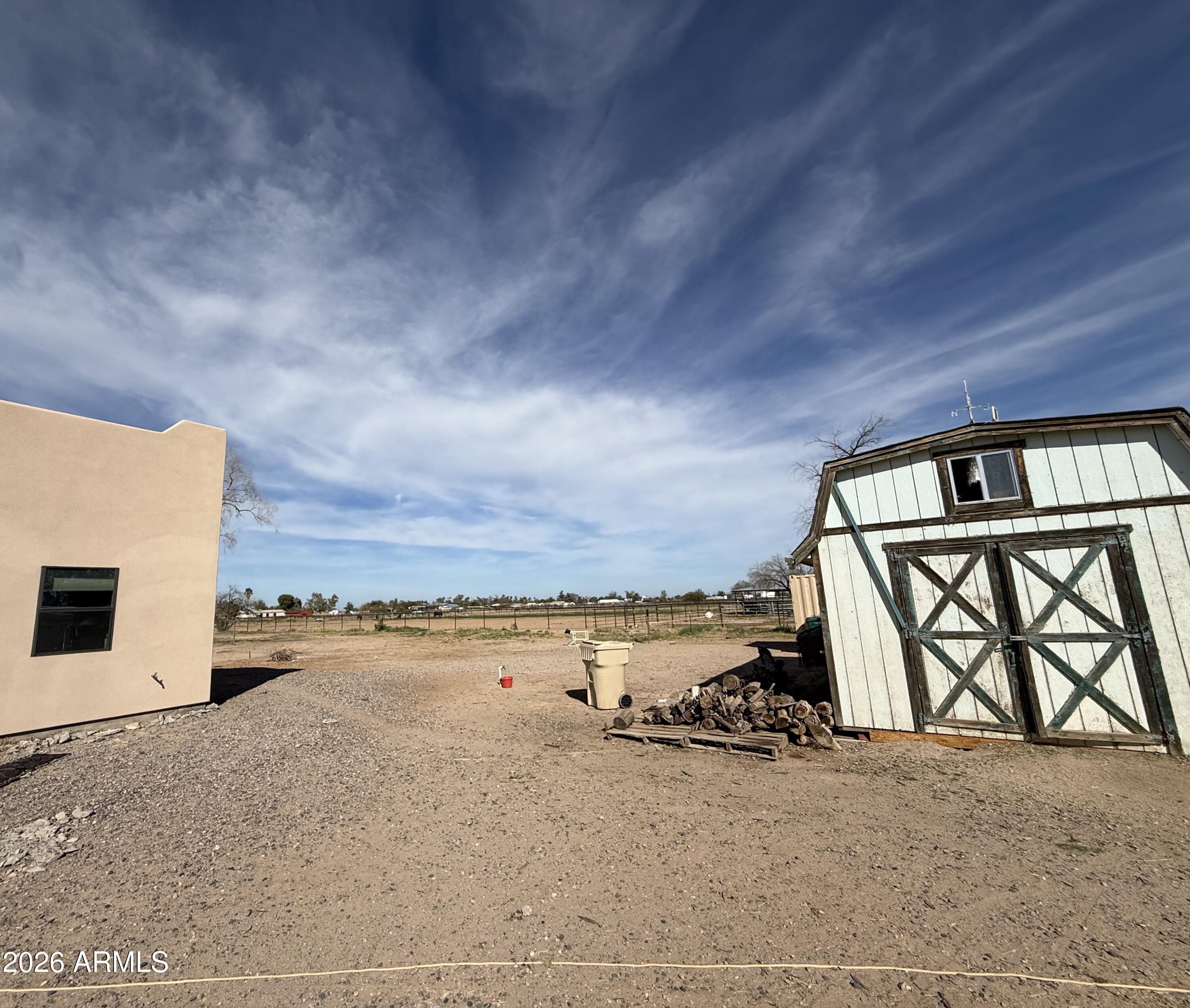 10545 North Ralston Road Maricopa, AZ 85139 - Photo 18 of 27 a view of a livingroom with furniture and a garage