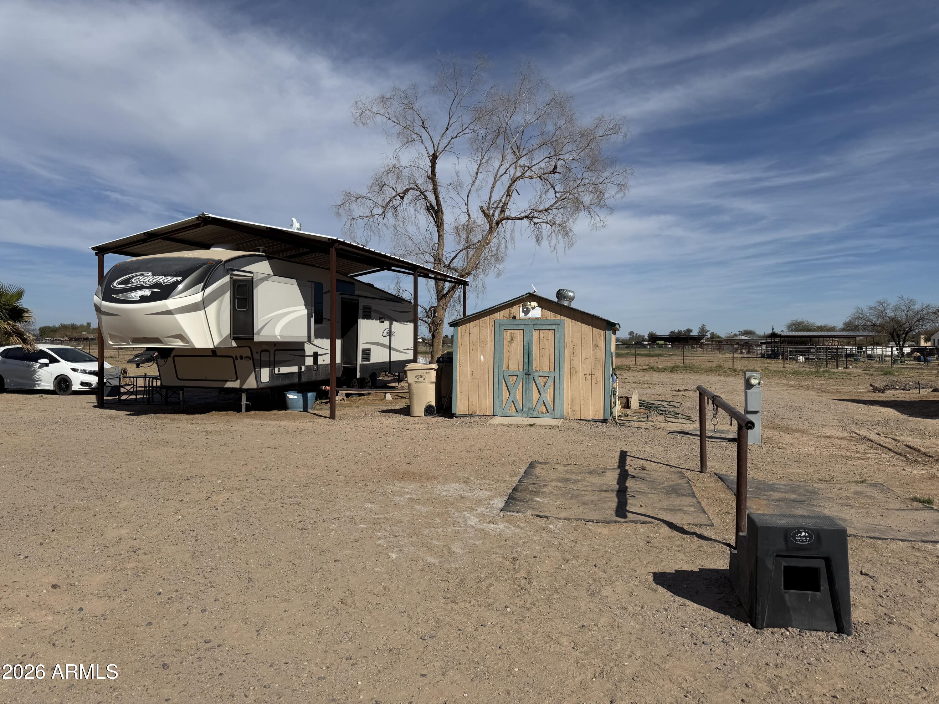 10545 North Ralston Road Maricopa, AZ 85139 - Photo 22 of 27 a view of a street with car parked