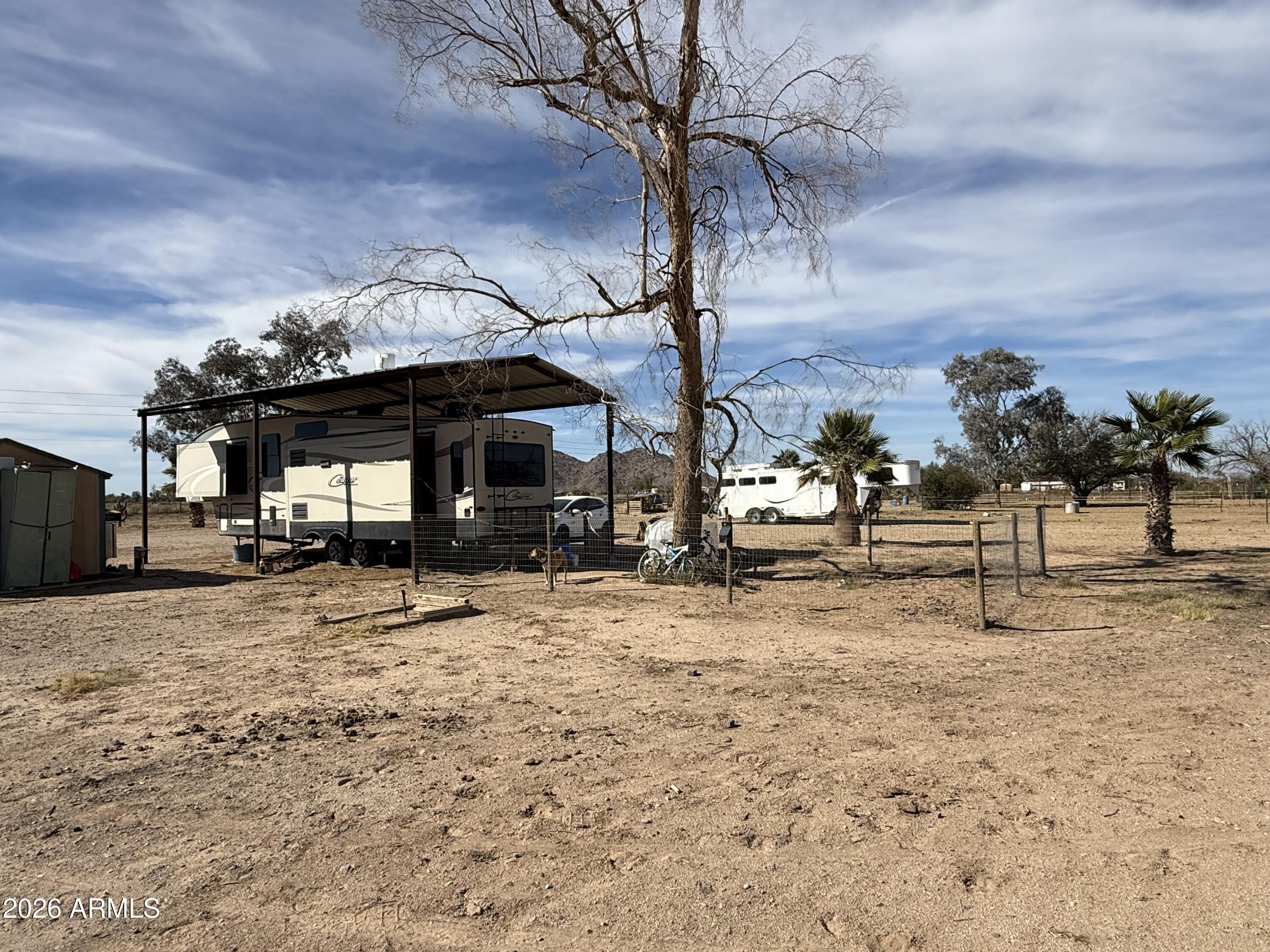 10545 North Ralston Road Maricopa, AZ 85139 - Photo 24 of 27 a view of a dirt road and a building