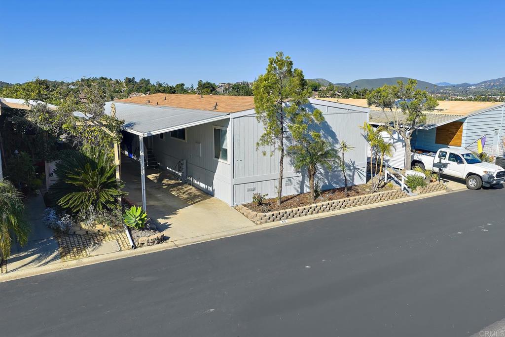 1195 La Moree Road, Unit SPC 42 San Marcos, CA 92078 - Photo 2 of 52 a view of a house with a street from a terrace