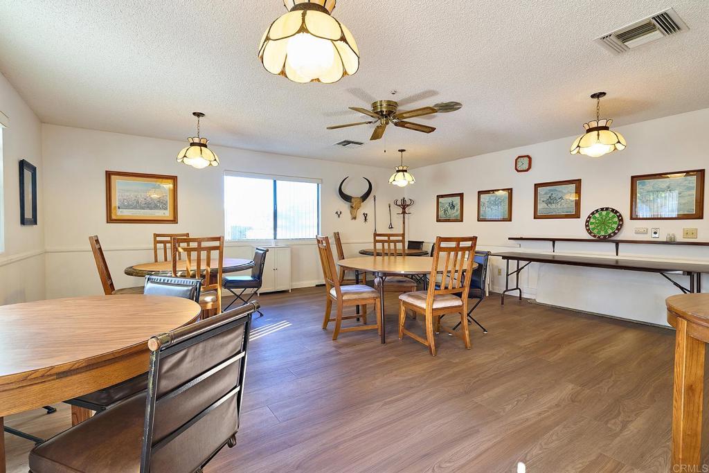 1195 La Moree Road, Unit SPC 42 San Marcos, CA 92078 - Photo 28 of 52 a view of a dining room with furniture window and wooden floor