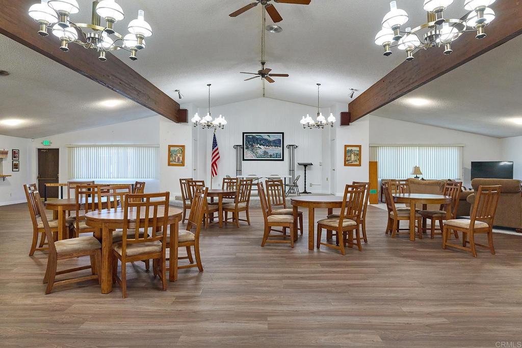 1195 La Moree Road, Unit SPC 42 San Marcos, CA 92078 - Photo 29 of 52 a view of a dining room with furniture and wooden floor