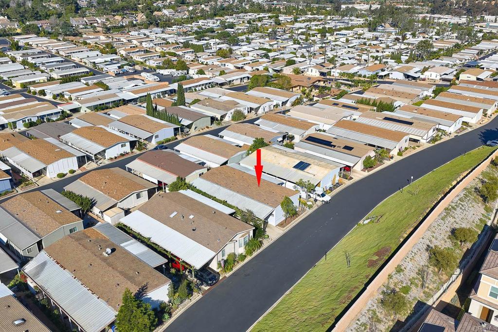 1195 La Moree Road, Unit SPC 42 San Marcos, CA 92078 - Photo 42 of 52 an aerial view of residential houses with outdoor space