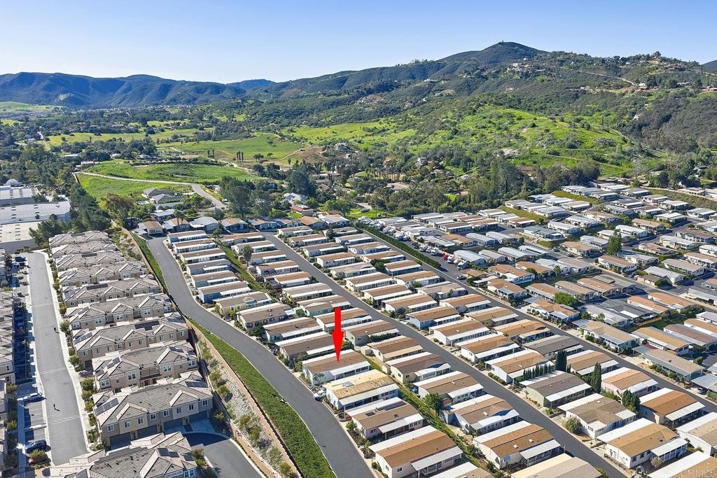 1195 La Moree Road, Unit SPC 42 San Marcos, CA 92078 - Photo 46 of 52 a view of a lush green field with mountains in the background
