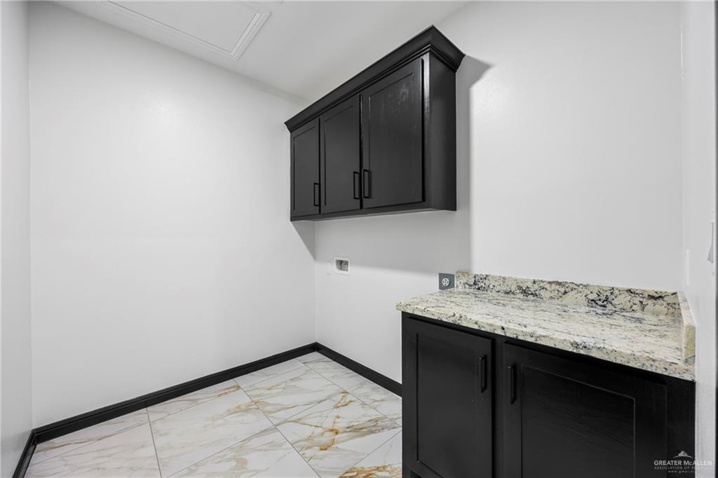 7 John Street Rio Grande City, TX 78582 - Photo 15 of 17 a bathroom with a sink and a mirror