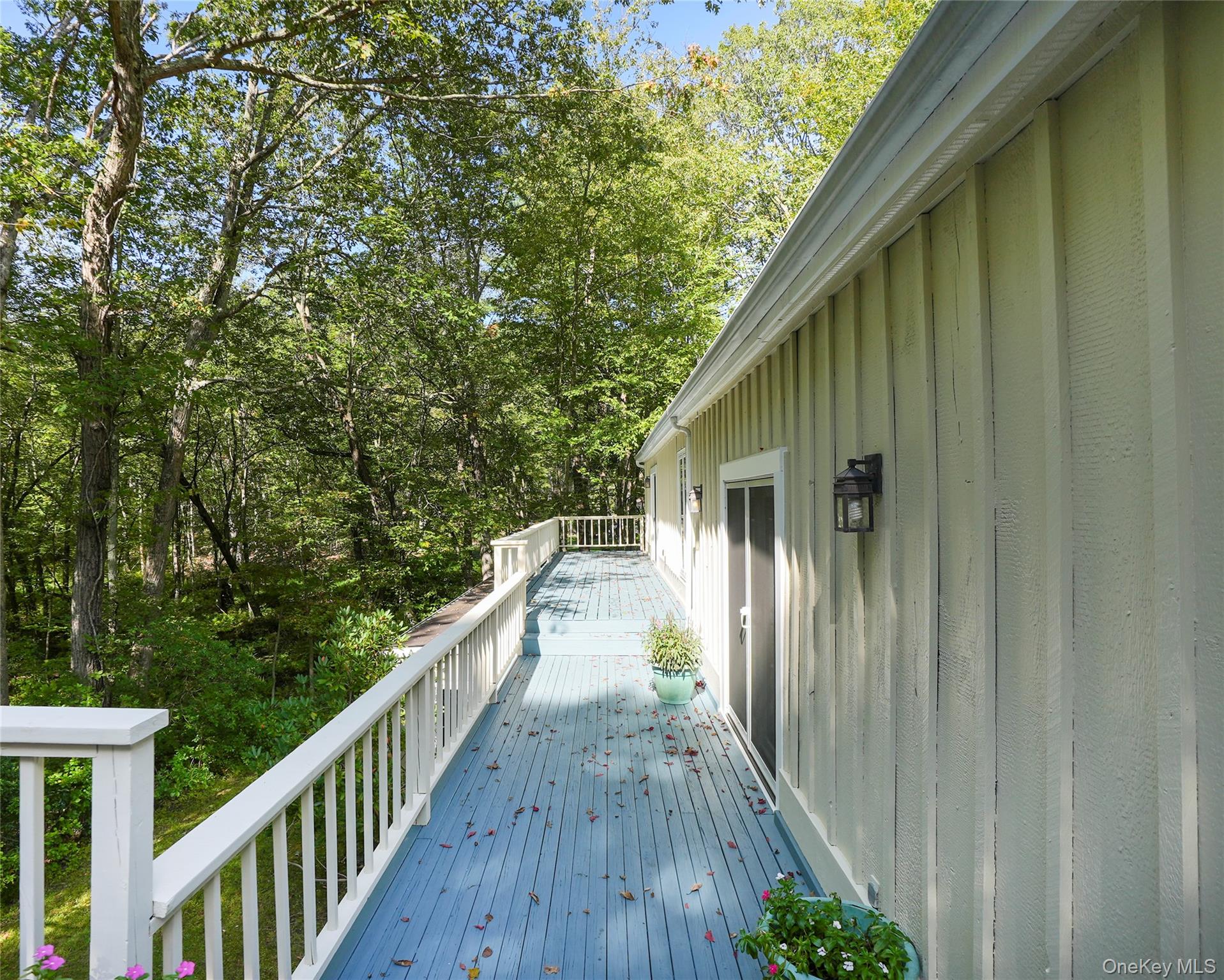22 Peters Lane Pound Ridge, NY 10576 - Photo 39 of 43 Expansive outdoor deck with blue-painted wood-finish flooring and white railings