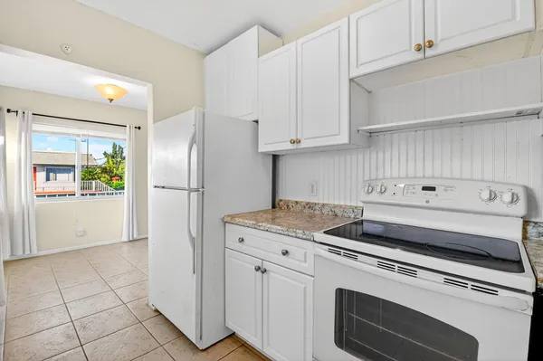 a kitchen with appliances and cabinets