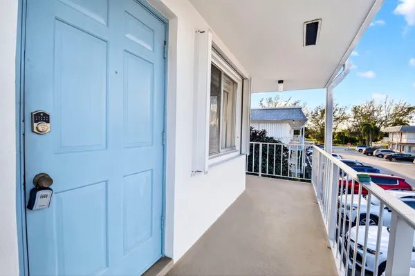 a view of a hallway with kitchen view