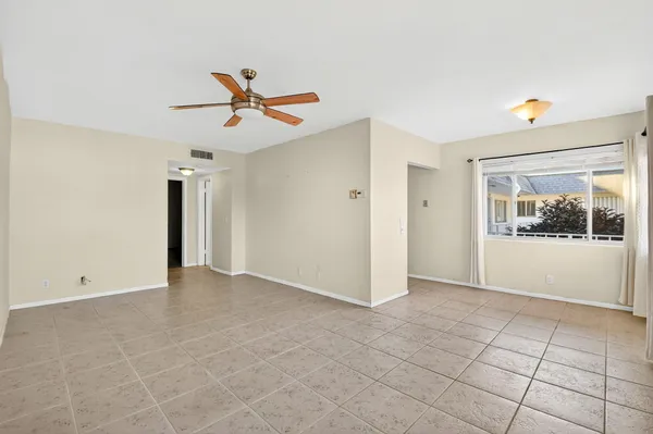 a view of an empty room with a window