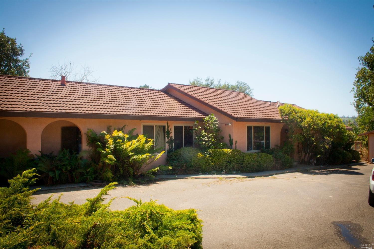 8507 Mill Station Road Sebastopol, CA 95472 - Photo 1 of 1 a front view of a house with garden
