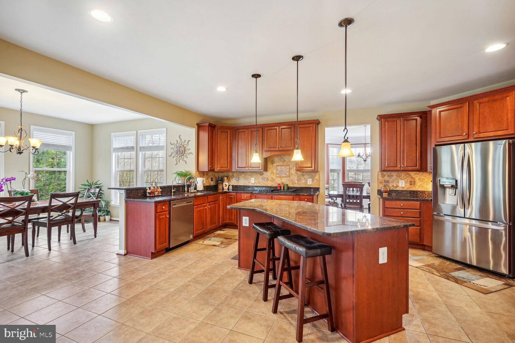 9323 Castle Hill Road Springfield, VA 22153 - Photo 8 of 66 Granite Island & Mahogany Cabinets