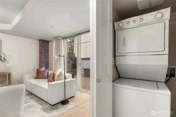 a white refrigerator freezer sitting in a living room