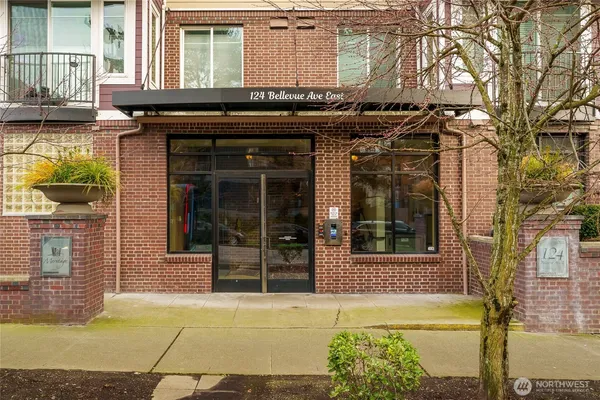 front view of a brick building with a blue door