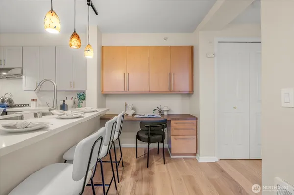 a view of a kitchen with a table and chairs