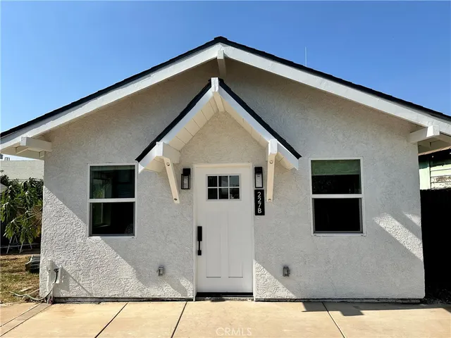 a backyard of a house with seating space
