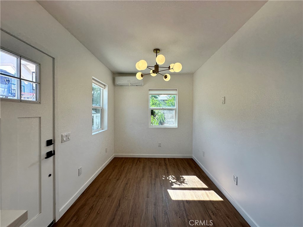 227 East Main Street, Unit B San Gabriel, CA 91776 - Photo 2 of 7 wooden floor in an empty room with a window