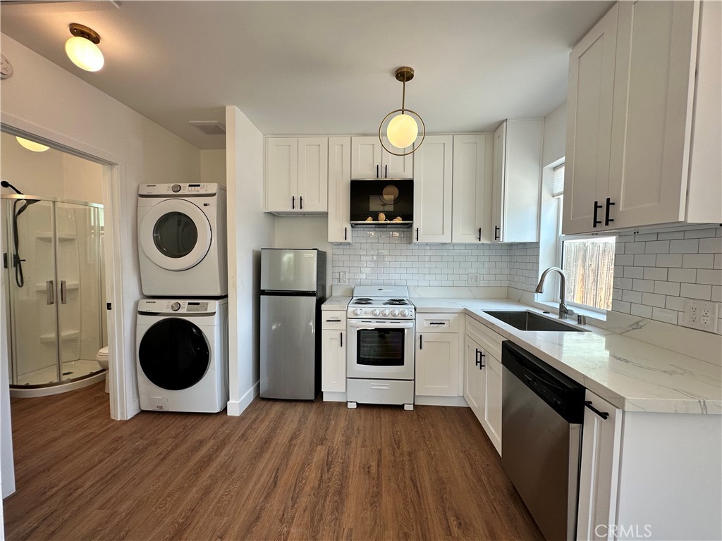 227 East Main Street, Unit B San Gabriel, CA 91776 - Photo 3 of 7 a kitchen with stainless steel appliances a stove a sink and a microwave