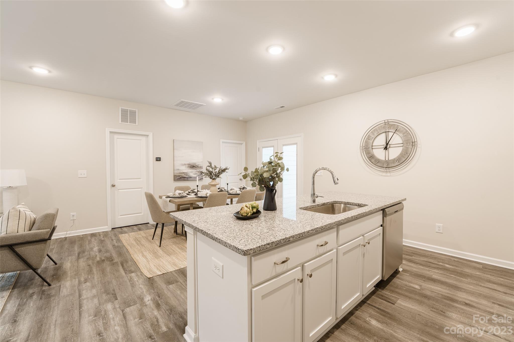 2113 Tom Sadler Road Charlotte, NC 28214 - Photo 13 of 31 a view of a kitchen area with furniture and wooden floor