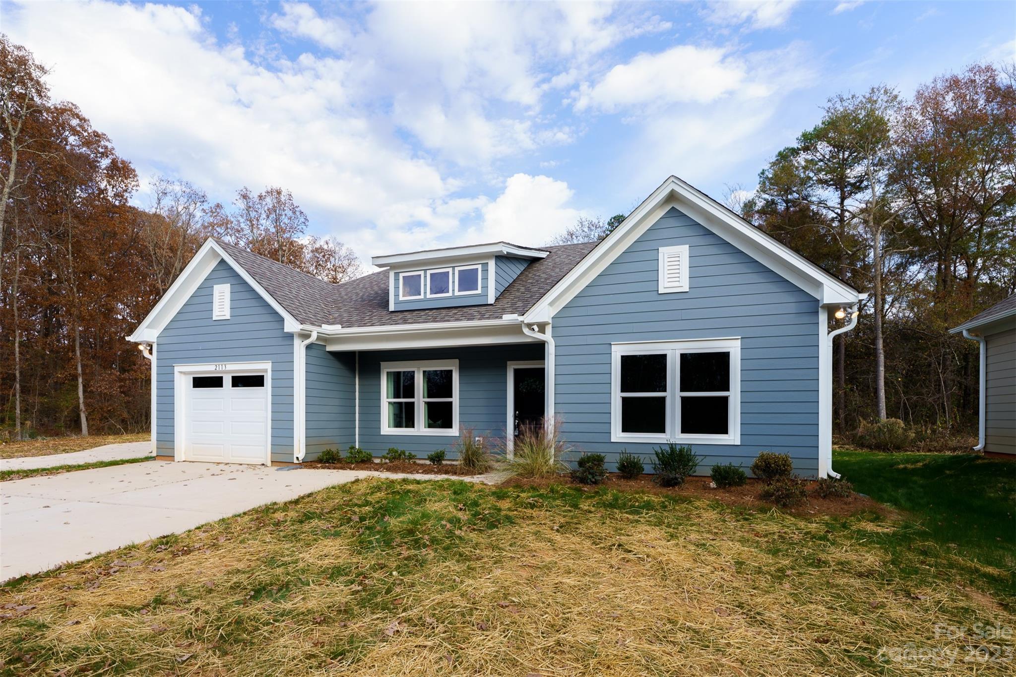 2113 Tom Sadler Road Charlotte, NC 28214 - Photo 3 of 31 a front view of a house with garden