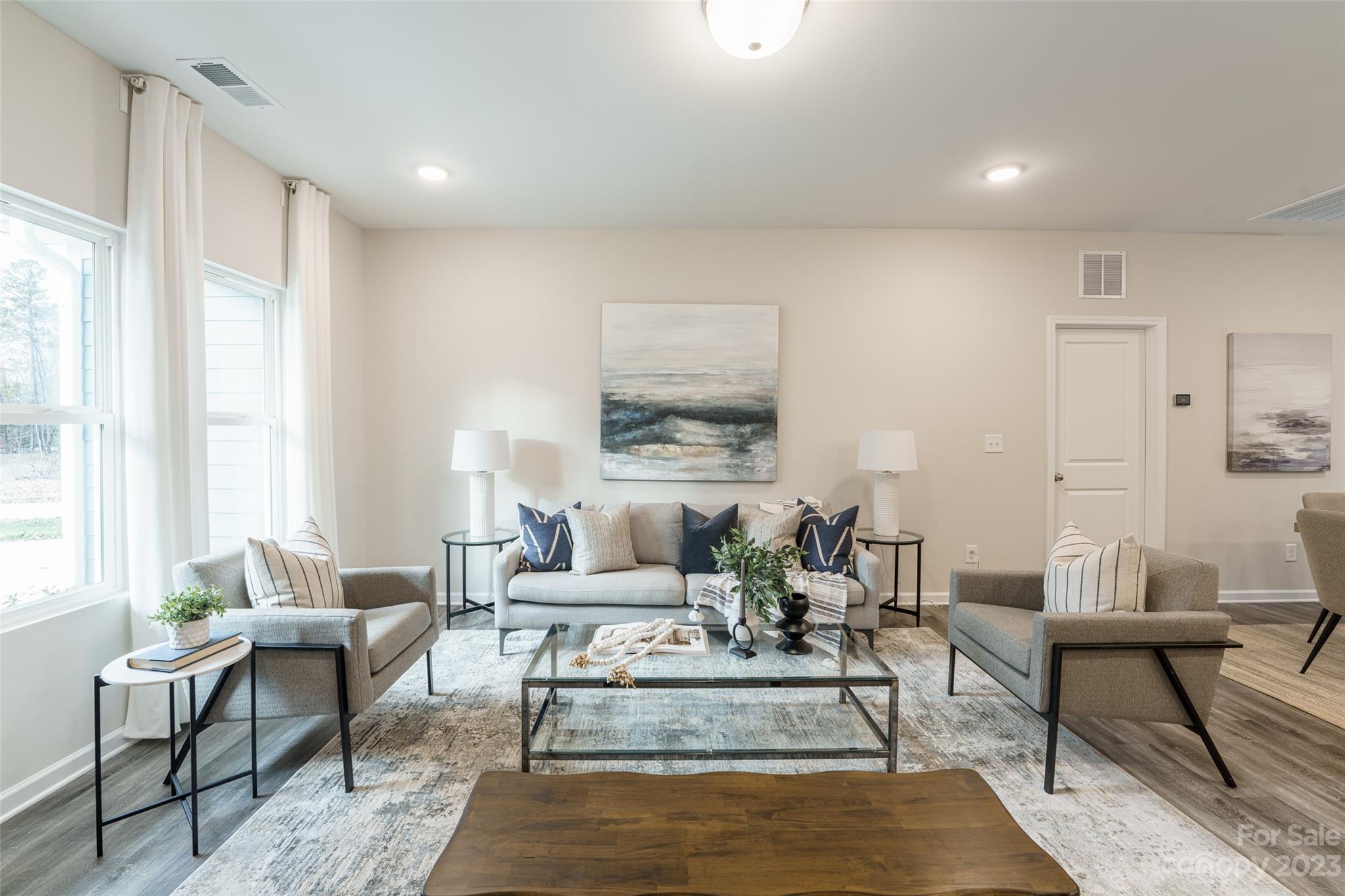 2113 Tom Sadler Road Charlotte, NC 28214 - Photo 5 of 31 a living room with furniture and a rug