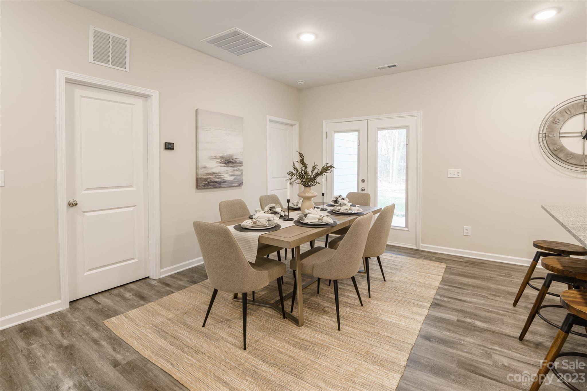 2113 Tom Sadler Road Charlotte, NC 28214 - Photo 8 of 31 a view of a dining room with furniture and wooden floor