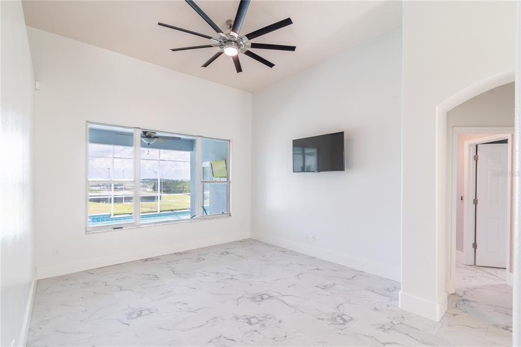 3862 Beacon Ridge Way Clermont, FL 34711 - Photo 14 of 56 a view of an empty room with a window