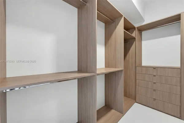 a bathroom with a bathtub and shower