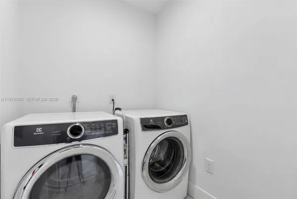a utility room with dryer and washer