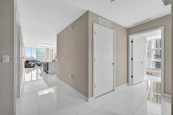 a view of kitchen with furniture and refrigerator