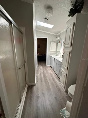 a view of a kitchen from the hallway