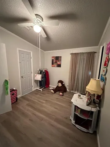 a room with furniture and gym equipment