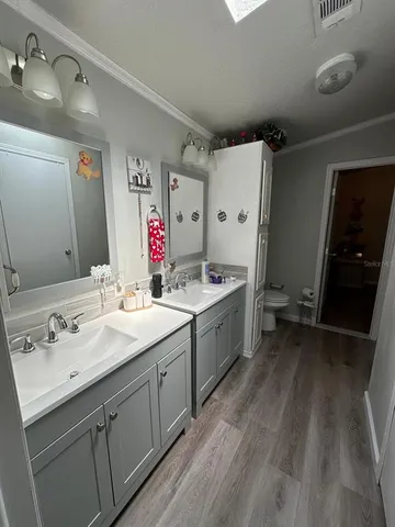 a view of bathroom with dual sinks