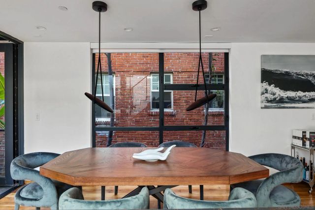 a view of a dining room with furniture window and wooden floor