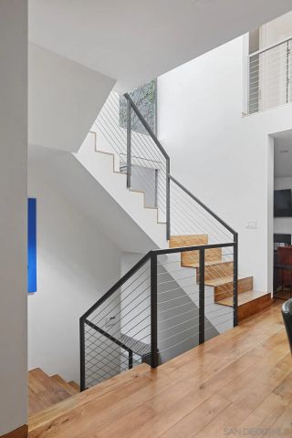 a view of an entryway with wooden floor
