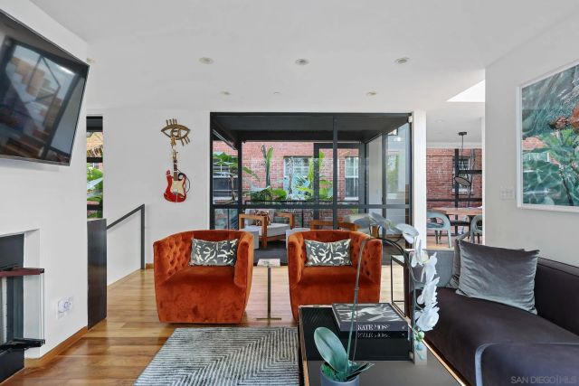 a living room with fireplace furniture and a flat screen tv
