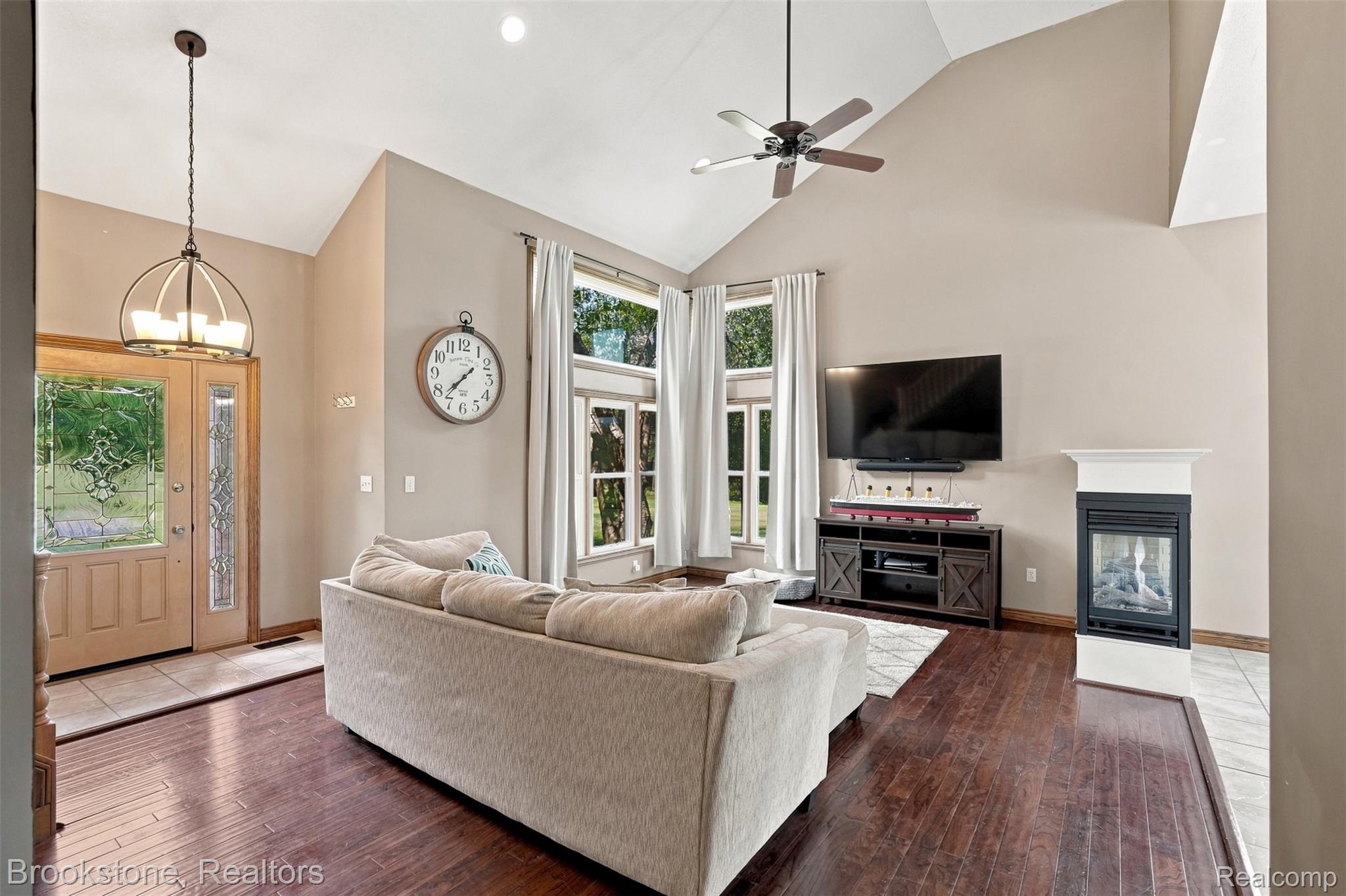 1775 Dutcher Road Howell, MI 48843 - Photo 5 of 41 Vaulted ceilings, wood-finish flooring, and ample natural light