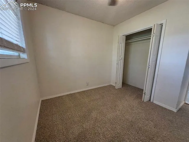 an empty room with closet