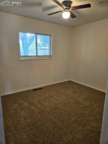 a view of a couches in backyard of house