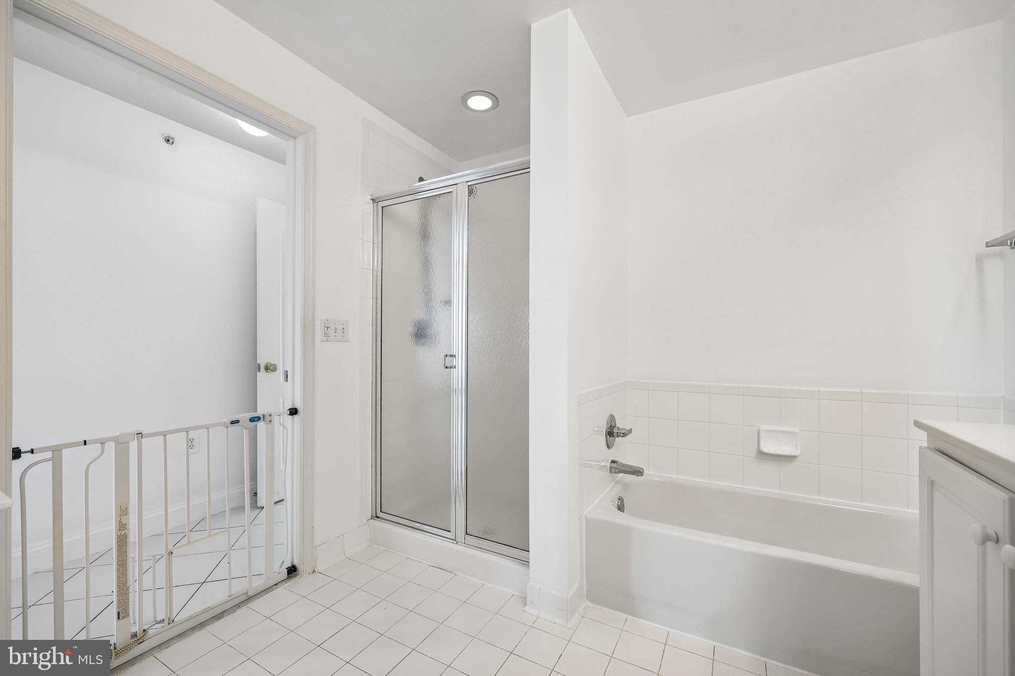 12824 Clarksburg Square Road, Unit 403 Clarksburg, MD 20871 - Photo 13 of 38 Ensuite primary bath with separate shower and tub