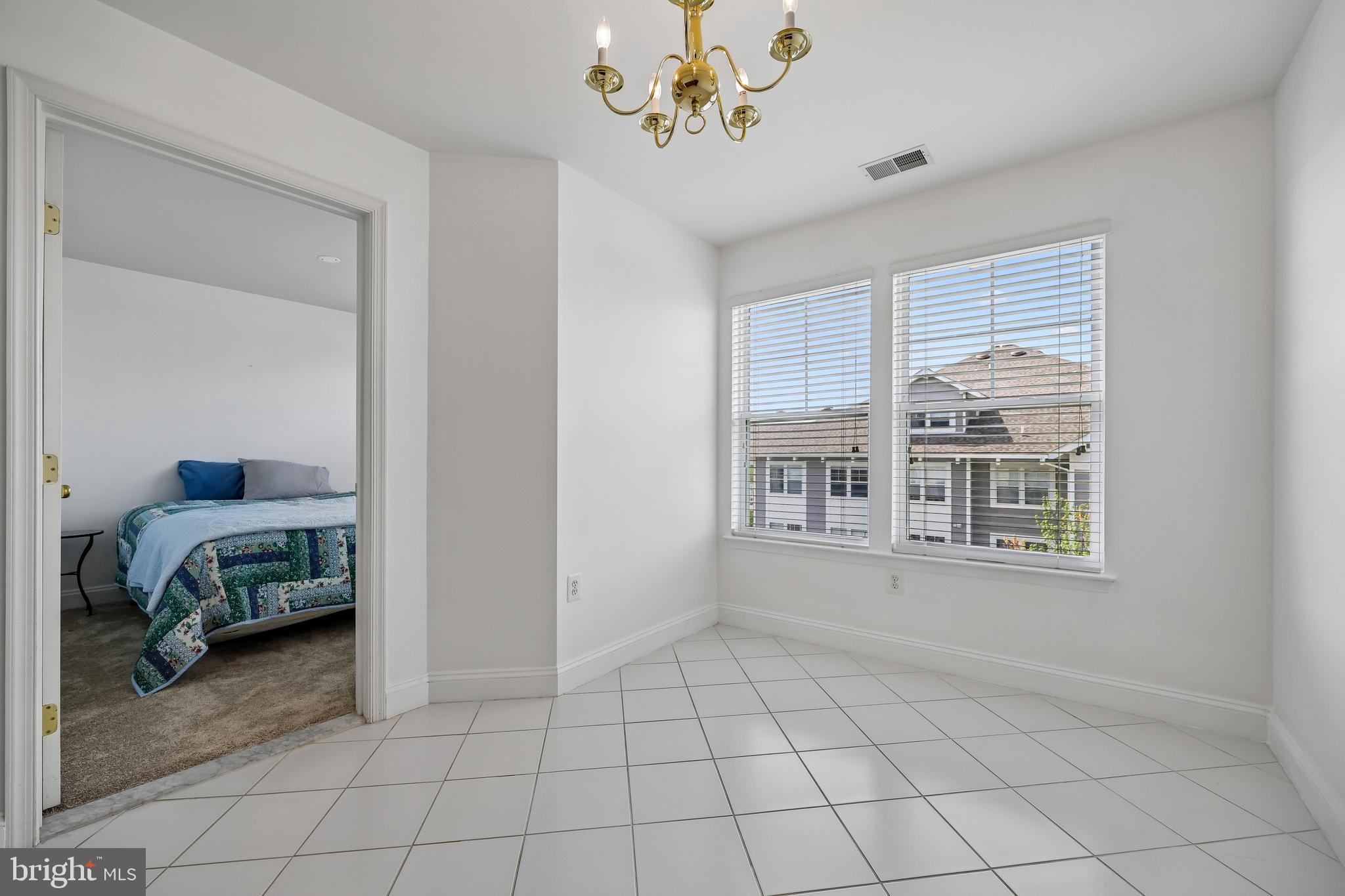 12824 Clarksburg Square Road, Unit 403 Clarksburg, MD 20871 - Photo 16 of 38 Main level sitting/flex room by 2nd bedroom