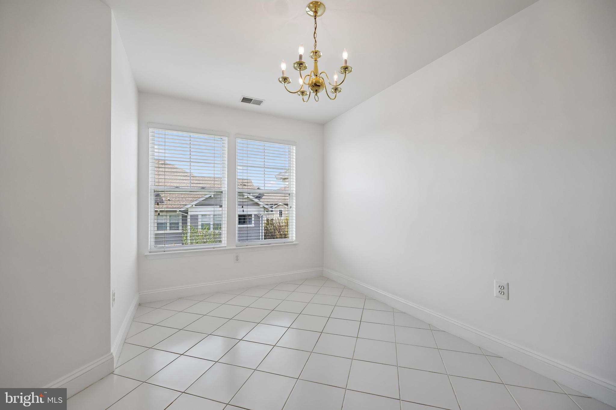 12824 Clarksburg Square Road, Unit 403 Clarksburg, MD 20871 - Photo 17 of 38 Main level sitting/flex room by 2nd bedroom