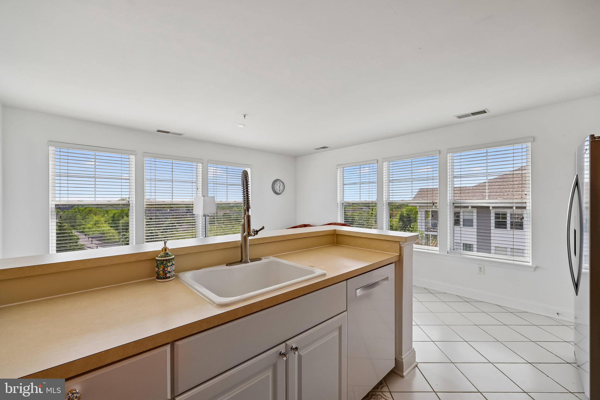 12824 Clarksburg Square Road, Unit 403 Clarksburg, MD 20871 - Photo 5 of 38 Kitchen island