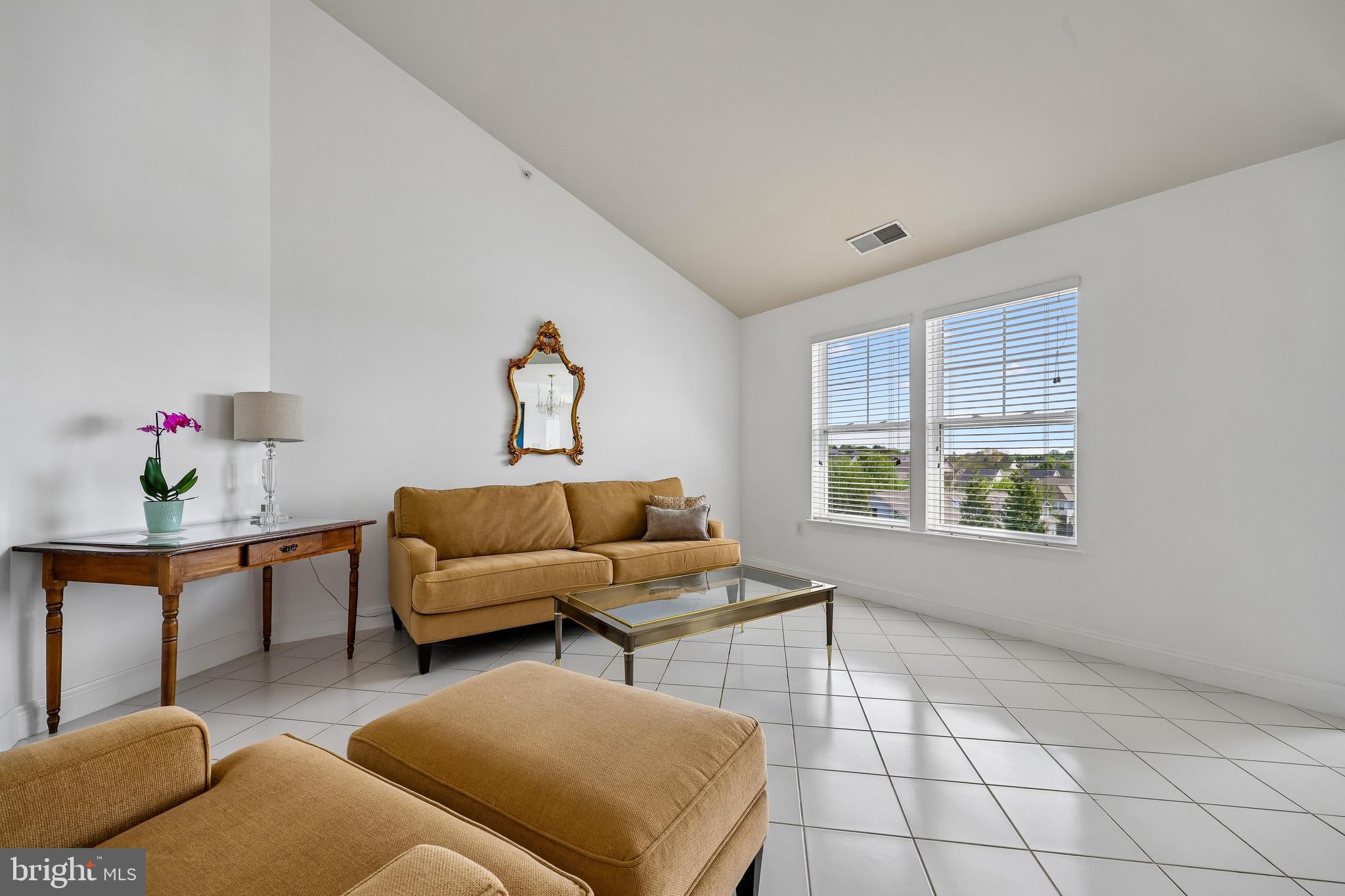 12824 Clarksburg Square Road, Unit 403 Clarksburg, MD 20871 - Photo 9 of 38 Spacious living room brings in natural light