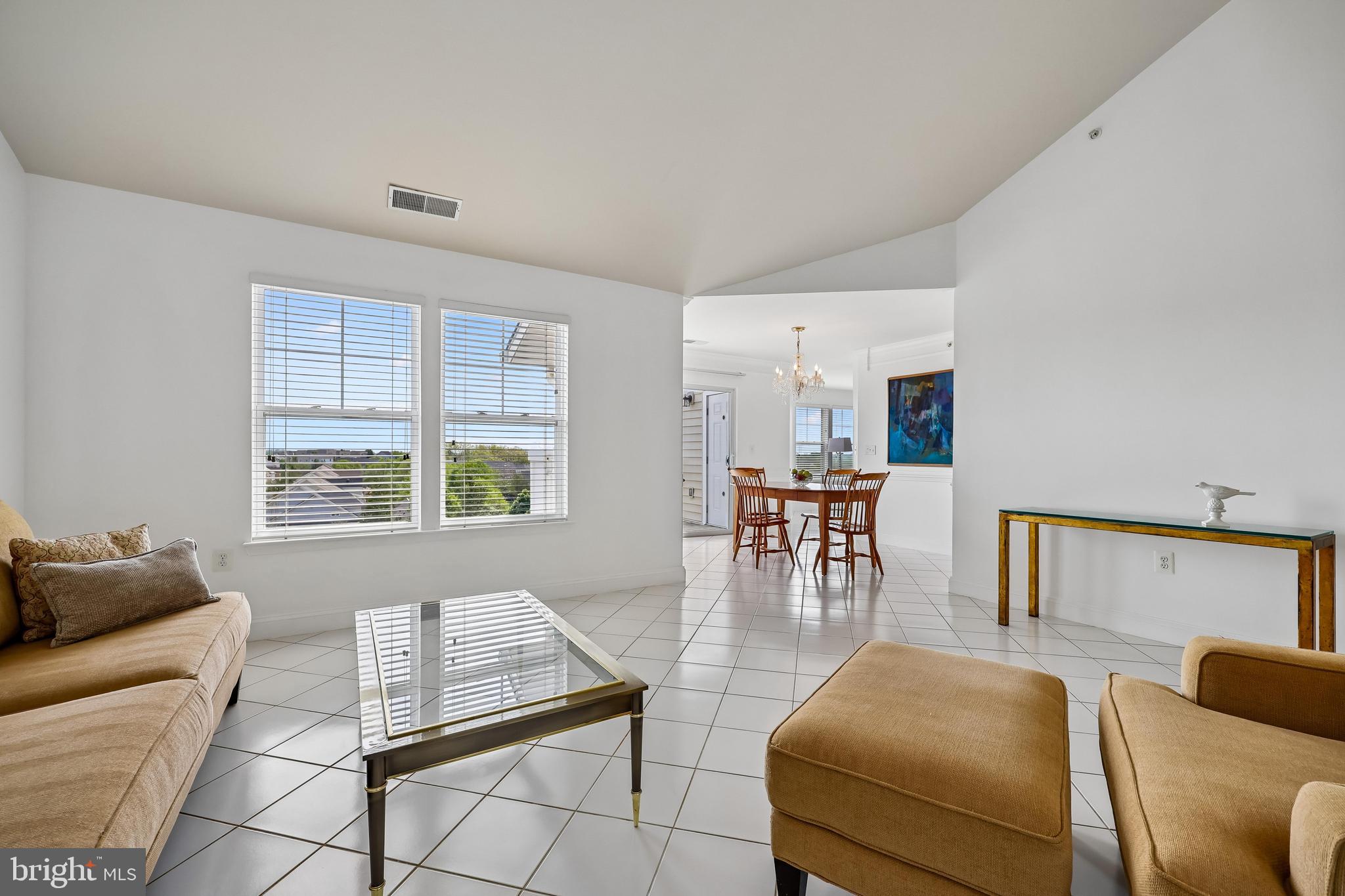 12824 Clarksburg Square Road, Unit 403 Clarksburg, MD 20871 - Photo 10 of 38 Spacious living room connects to dining room
