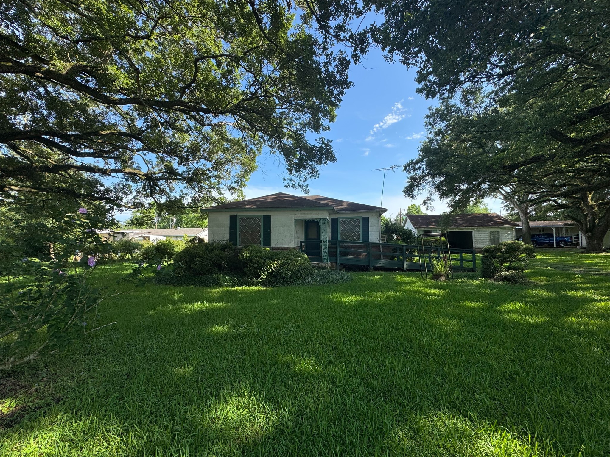 416 Baker Circle Ames, TX 77575 - Photo 2 of 9 a front view of a house with garden
