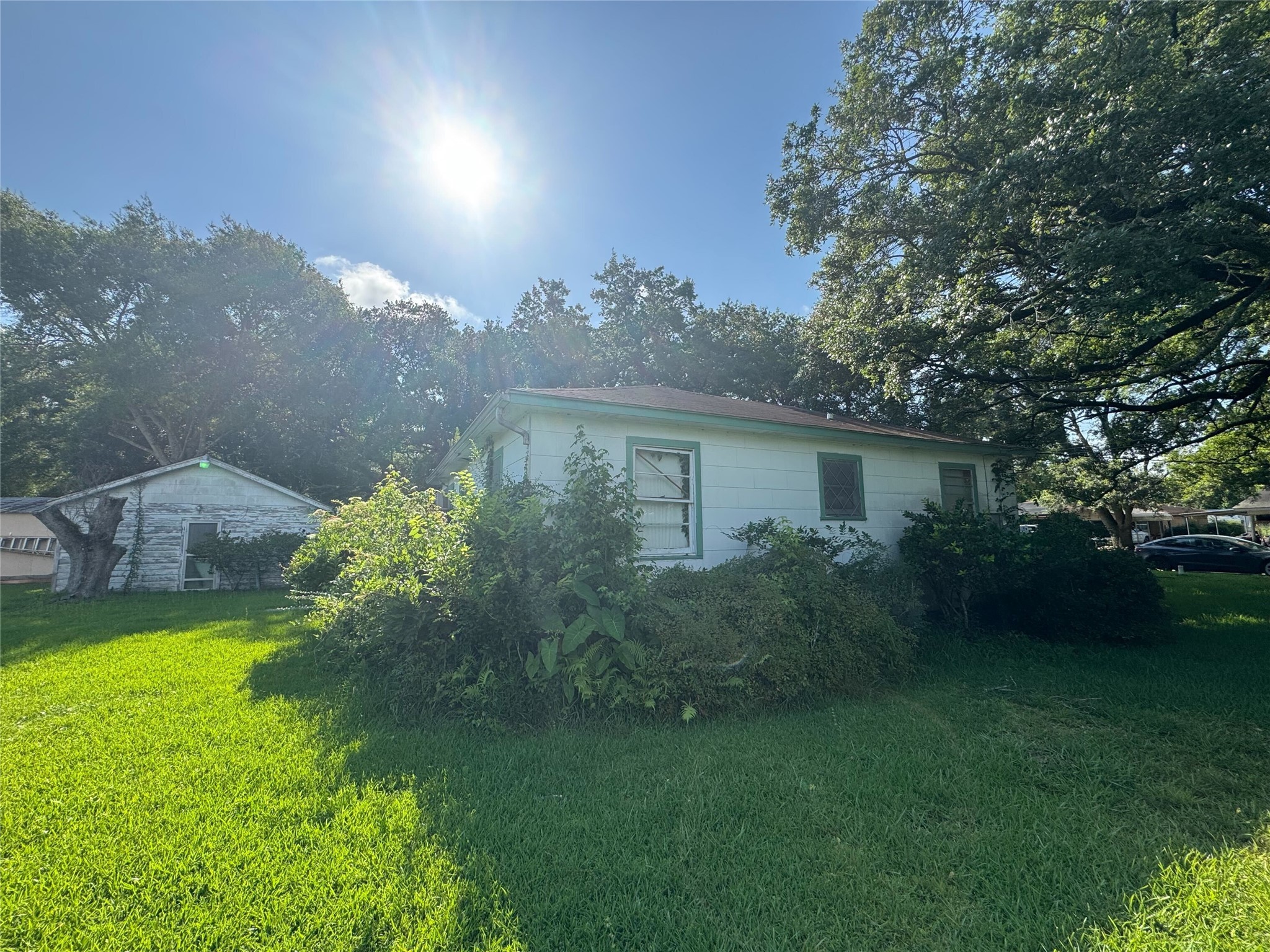 416 Baker Circle Ames, TX 77575 - Photo 5 of 9 a view of a house with a yard and a garden