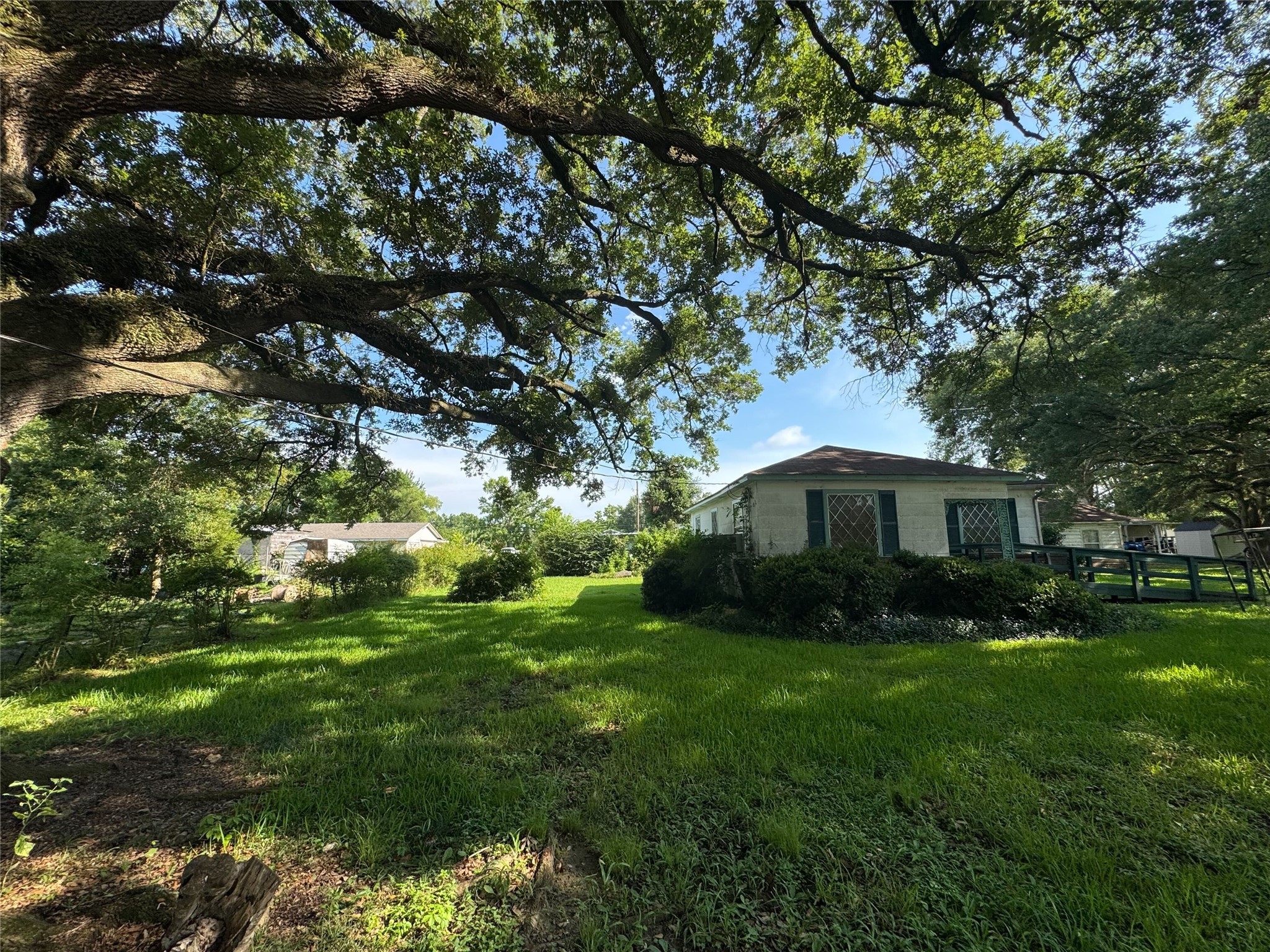 416 Baker Circle Ames, TX 77575 - Photo 7 of 9 a view of a house with a backyard